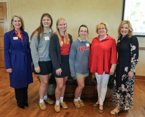 Students, faculty, and Karla Eslinger attend event.